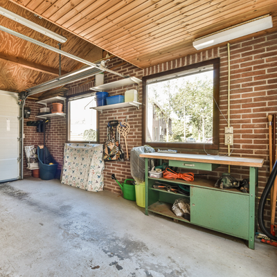 Garage mini split A large brick garage with shelves and windows
