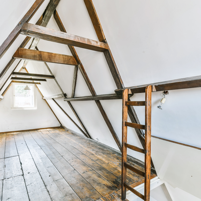 attic / loft mini split an a frame loft space with a wooden ladder leading to it and a small window