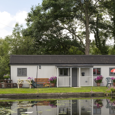 mobile home mini split a mobile home with a front awning and cottage style yard decorations