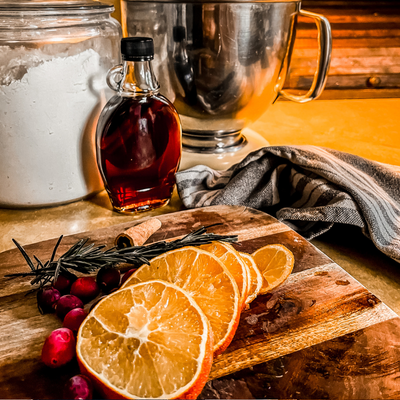 Orange, cranberry, and rosemary simmer pot ingredients for a wood stove chicken steamer