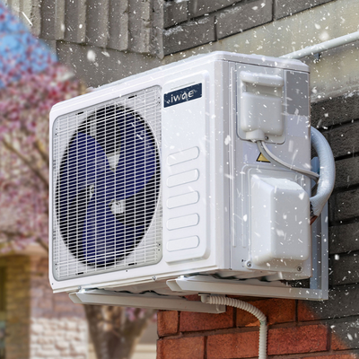 IWAE S-Series mini split heat pump The outdoor condenser for an IWAE S-series mini split heat pump, heating in snowy weather